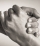 Close up image of a man giving a helping hand to a woman.